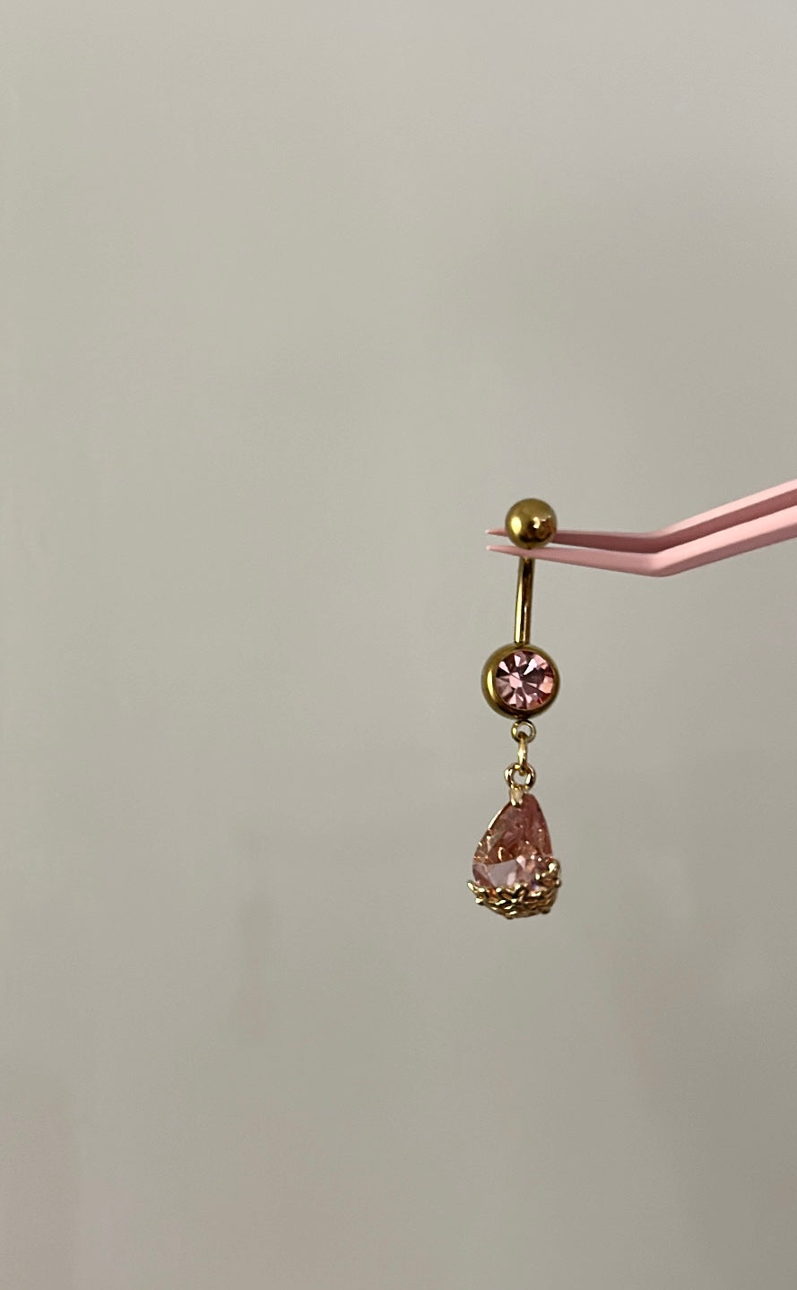 Gold tear drop pink diamanté belly bar