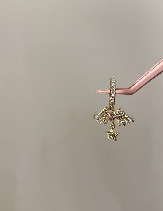 Gold star winged belly ring
